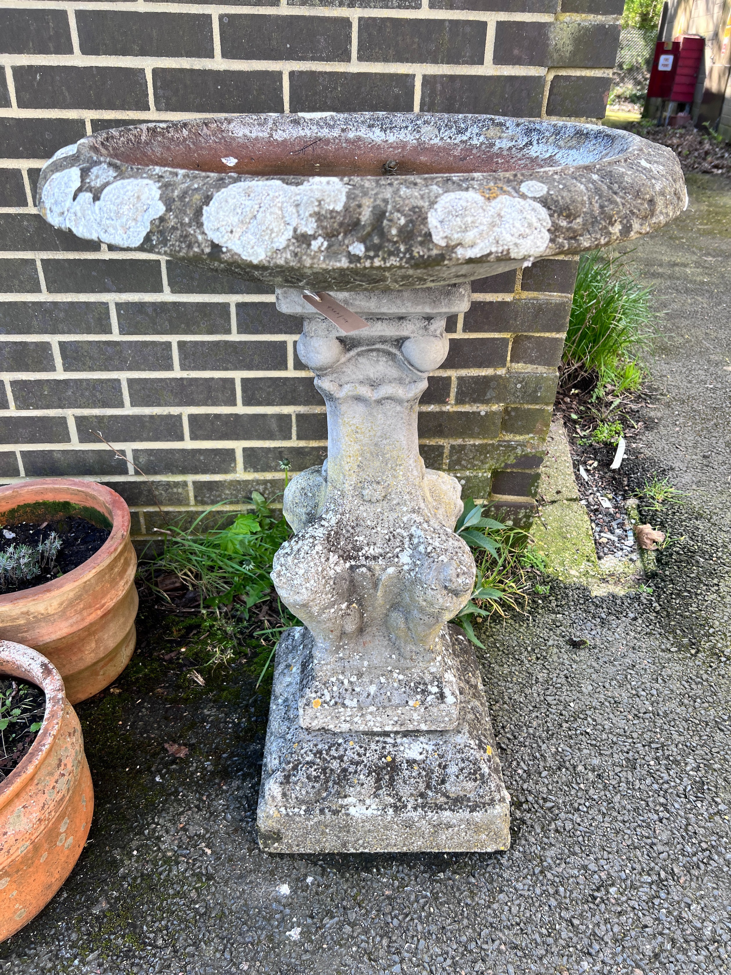 A circular reconstituted stone bird bath, diameter 65cm, height 94cm *Please note the sale commences at 9am.